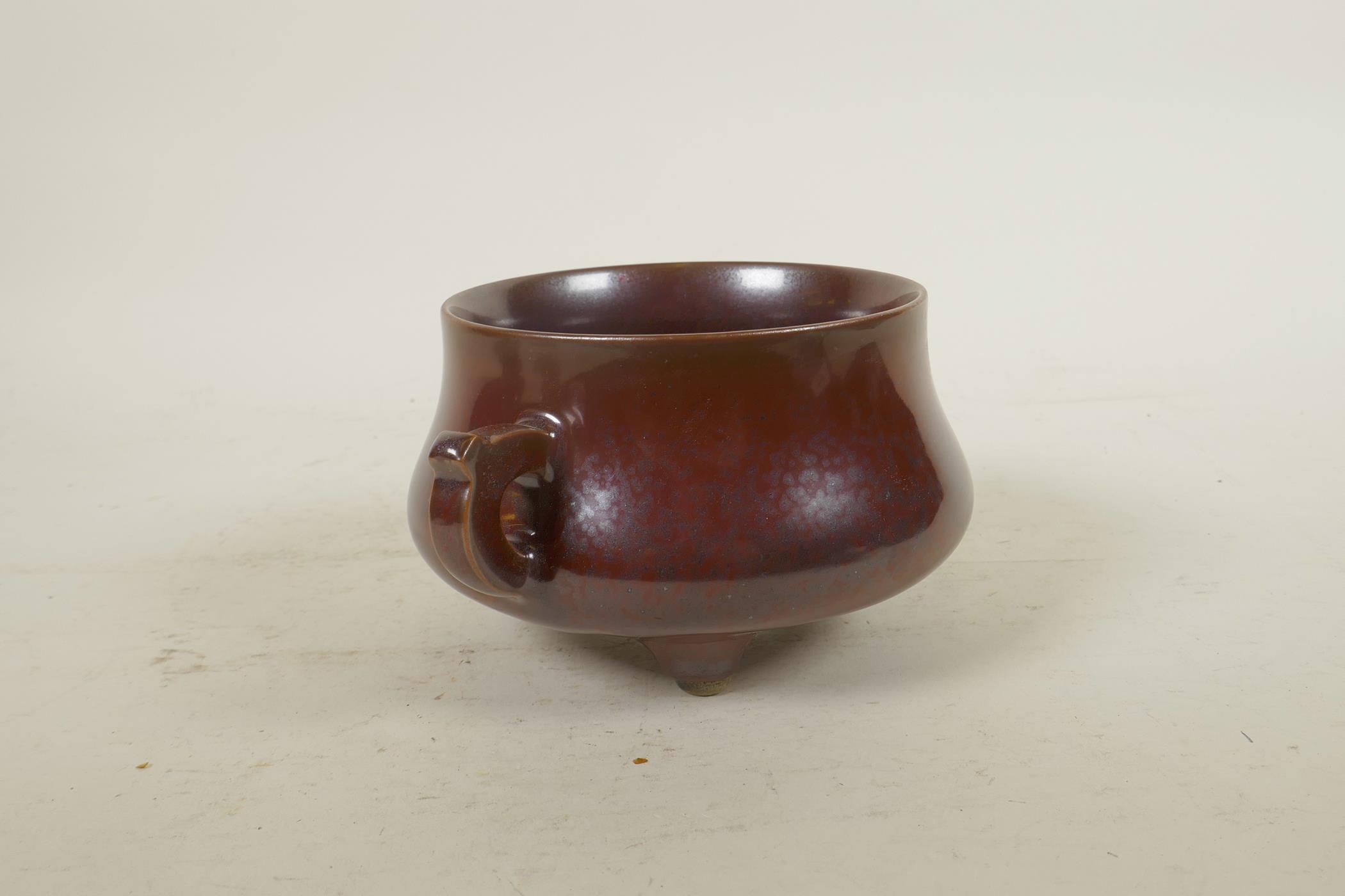 A Chinese copper glazed porcelain censer with two handles, raised on tripod supports, impressed seal - Image 2 of 6
