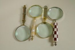 Four desk top magnifying glasses with glass, brass and shell handles, 10" diameter