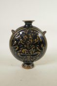 A Chinese Cizhou kiln pottery flask with raised floral decoration, 8" high