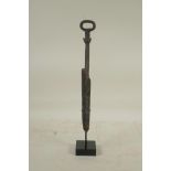 A Chinese bronzed metal dagger, on a display mount, 12" high