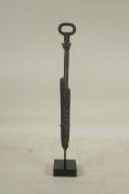 A Chinese bronzed metal dagger, on a display mount, 12" high