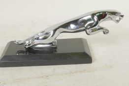 A desk top chrome plated paperweight in the form of a Jaguar car mascot, 7½" long