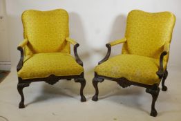 A pair of Chippendale style open armchairs with Chinese silk covers