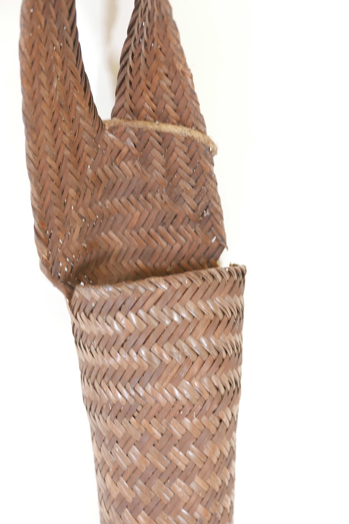 A Nagaland long woven rattan basket, 59" long - Image 2 of 2