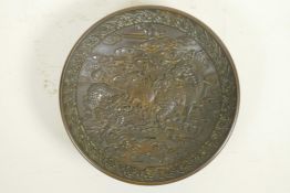 A Chinese bronze dish with raised kylin and flaming pearl decoration, impressed 4 character mark