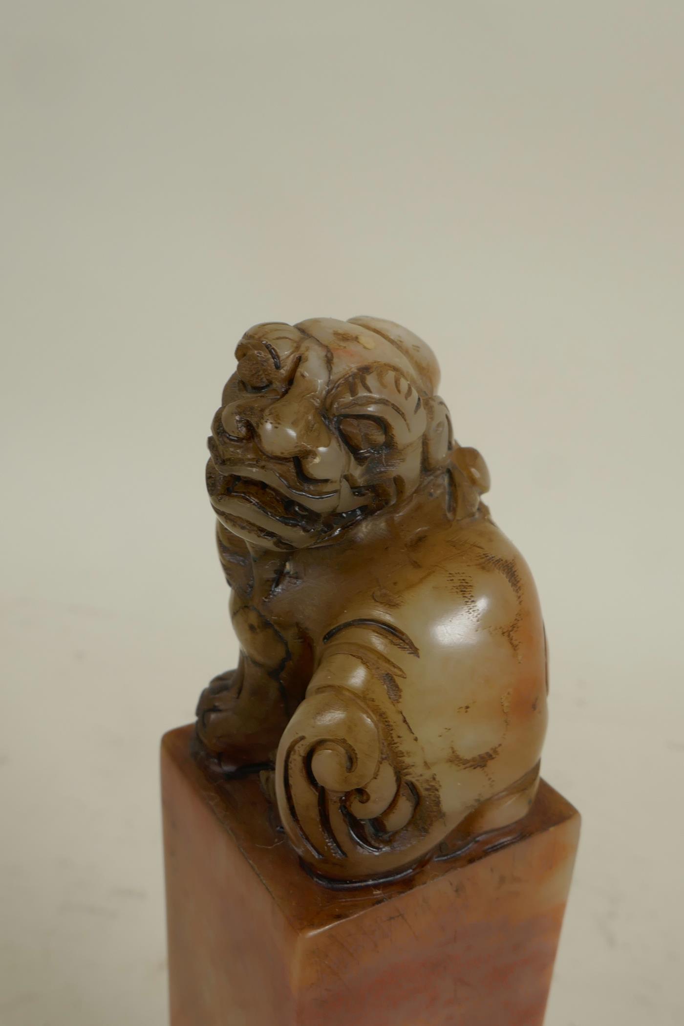 A square section Chinese carved soapstone seal, the top carved as a fo dog, 6" high - Image 3 of 4
