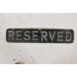 A vintage aluminium 'Reserved' sign, 23" x 5"