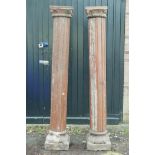 Architectural salvage: A pair of Indian carved and painted teak reeded columns, with carved