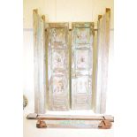 Architectural salvage: A pair of Indian teak storm doors, with frame, each door with four moulded
