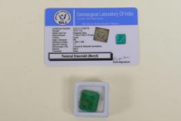 An 18.55ct natural emerald, octagon step cut, colour enhanced, certified by Gemological Laboratory