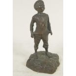 A small bronze figure of a boy, 6½" high