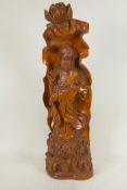 A Chinese carved wood figure of Guan Yin standing on a lotus throne, 20" high