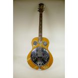 A semi acoustic Resonator 6 string guitar with mother of pearl inlay depicting a dragon and hawk,