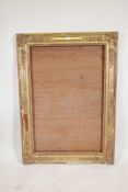 A good C19th gilt composition frame with scroll, leaf and floral decoration, 39" x 26"