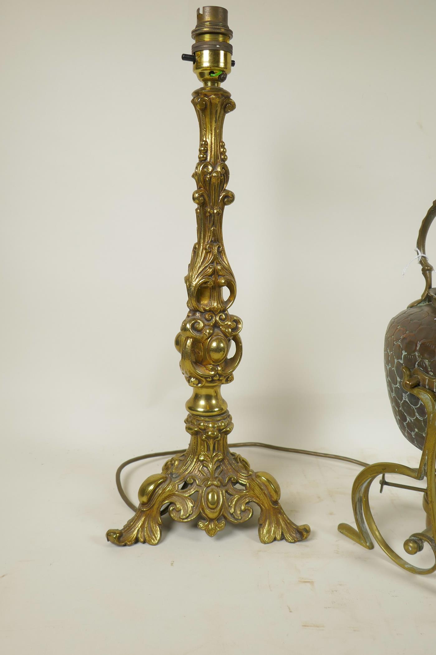 A pair of bronzed metal lamps on triform bases with gadrooned and swag moulded decoration, - Image 2 of 4