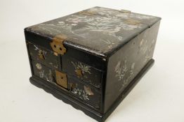 A Japanese black lacquer vanity box with three drawers and mirror compartment extensively inlaid