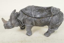 A cold painted cast bronze inkwell in the form of a rhinoceros, 6½" long