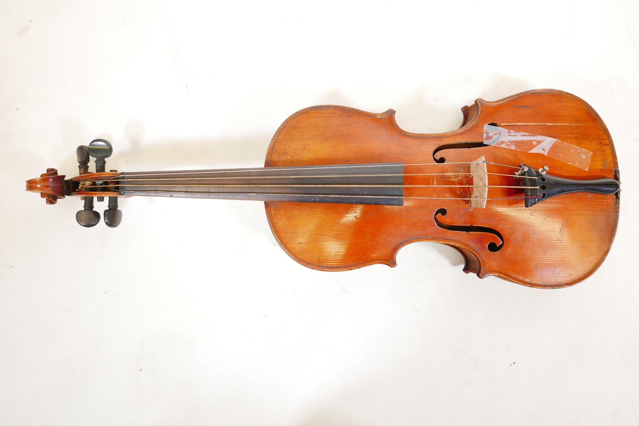 A late C19th/early C20th violin in ebonised wood case, no label, one piece back, split to front, and