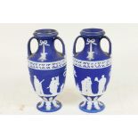 A pair of C19th Wedgwood Jasperware two handled pedestal vases decorated with Grecian figures, 6"
