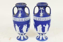 A pair of C19th Wedgwood Jasperware two handled pedestal vases decorated with Grecian figures, 6"