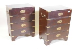 A pair of mahogany veneered and brass mounted campaign style chests with four drawers and military