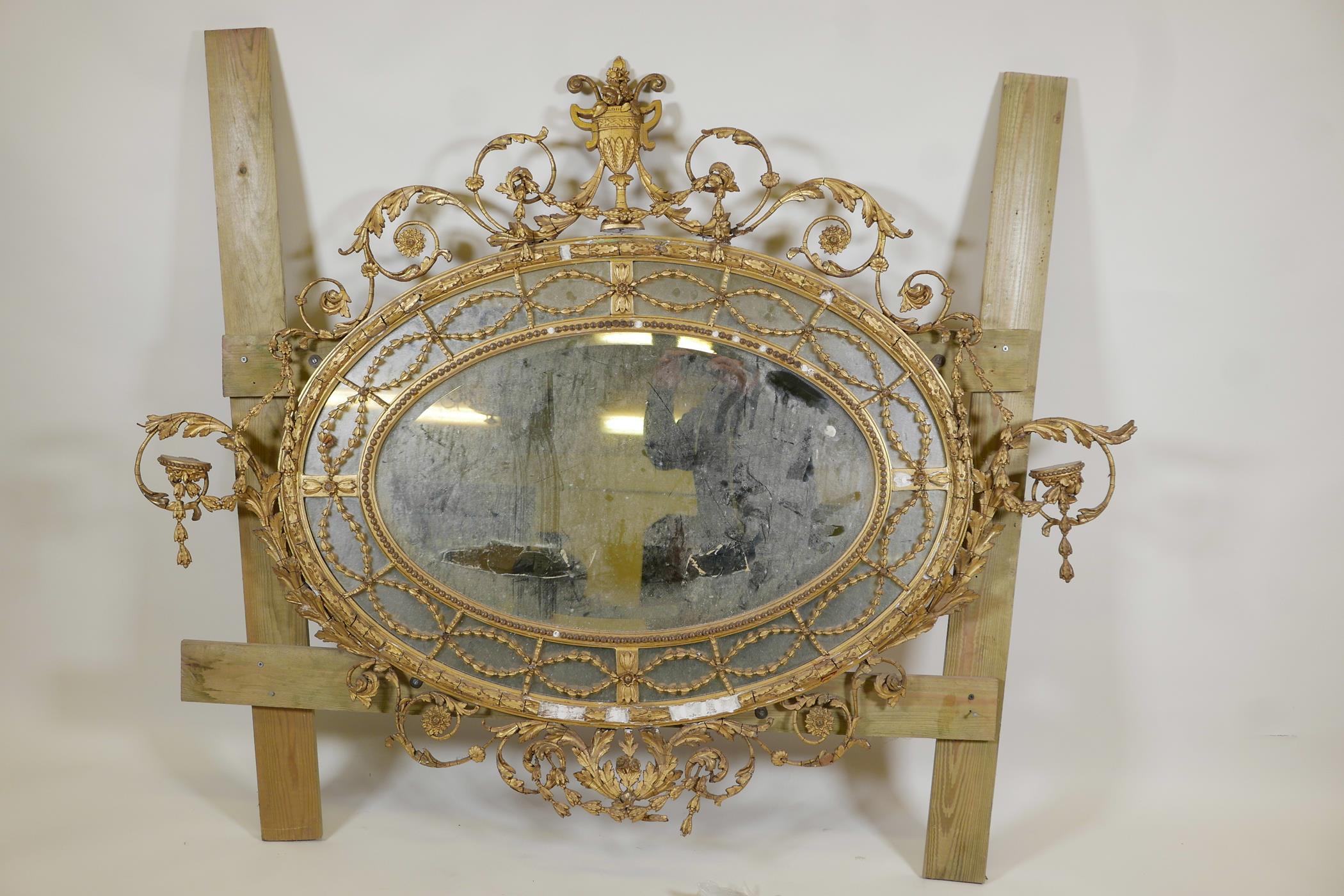 A C19th Adam style giltwood and composition sectional hall mirror, A/F, 60" x 46"