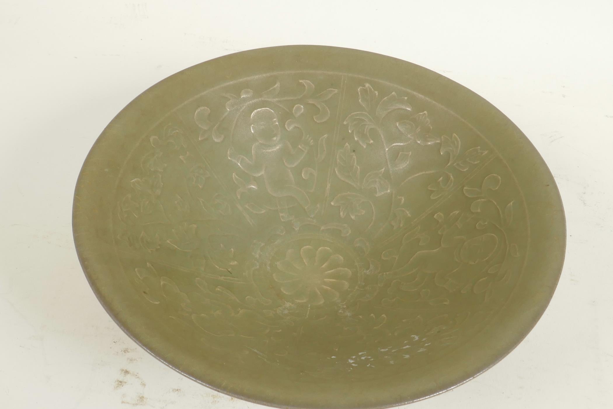 A Chinese celadon porcelain bowl, the interior embossed with figures, 7¼" diameter - Image 3 of 4