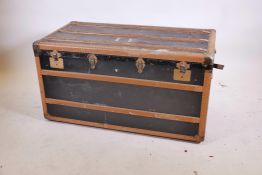 A vintage wood travelling trunk, with metal strapwork, 44" x 24" x 23"