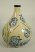 A Moorcroft style vase decorated with Liberty style tulips, 12" high