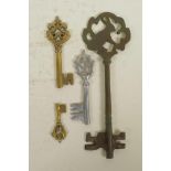 Four antique style keys in various metals, 11" largest