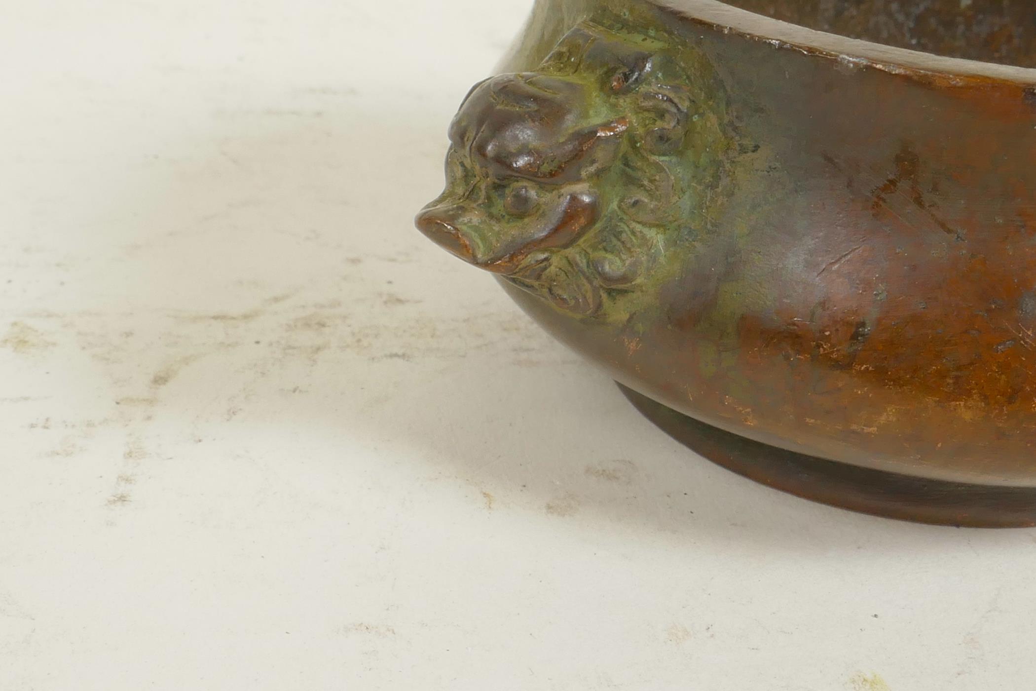 A Chinese miniature bronze censer with cast lion's mask handles, seal mark to base, 3" diameter - Image 2 of 3