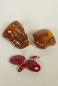 A pair of cherry amber cufflinks, and two reconstituted amber shards, 2½" largest