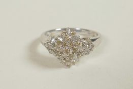 A 9ct white gold diamond cluster ring, approximate size 'M'