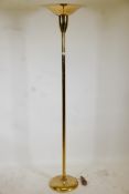 A brass uplighter, 70" high