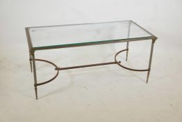 A chrome, steel and brass occasional table with reeded supports and shaped stretcher, 42" x 20" x