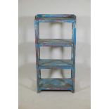 An Indian hardwood four tier open shelf with distressed paintwork, 23" x 13" x 46"