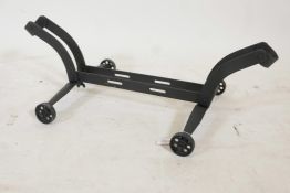 A vintage painted metal cycle stand, 22" x 8"