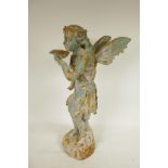 A cast iron garden figure of a fairy drinking from a lily pad, 21" high