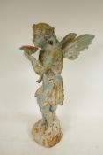 A cast iron garden figure of a fairy drinking from a lily pad, 21" high