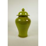 A Chinese lime green crackle glazed porcelain baluster jar and cover, 14" high