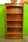 A hardwood open bookcase with fixed shelves and two drawers, 39" x 17" x 74"