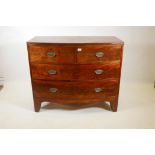 A Georgian mahogany bow front chest with reeded edge top and two over three drawers, with brass