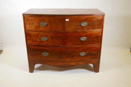 A Georgian mahogany bow front chest with reeded edge top and two over three drawers, with brass
