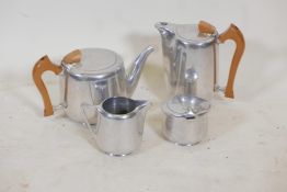 A Picquot ware four piece teaset including a lidded sugar bowl, water jug 7" high