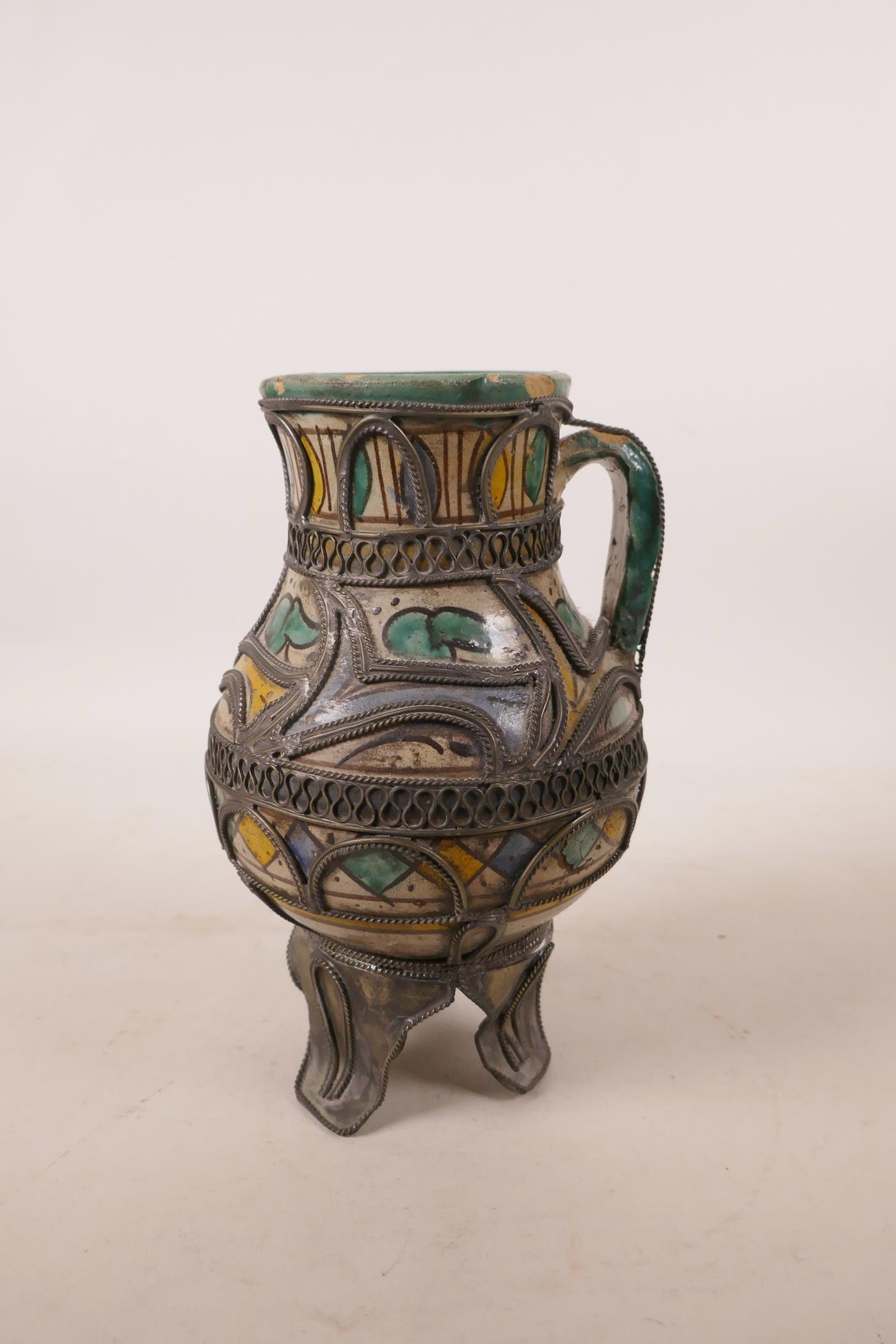 A North African pottery ewer with metal mounts, A/F repair to rim, 7½" high - Image 3 of 7