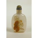 A Chinese agate snuff bottle with carved butterfly and pea pod decoration, 3" high