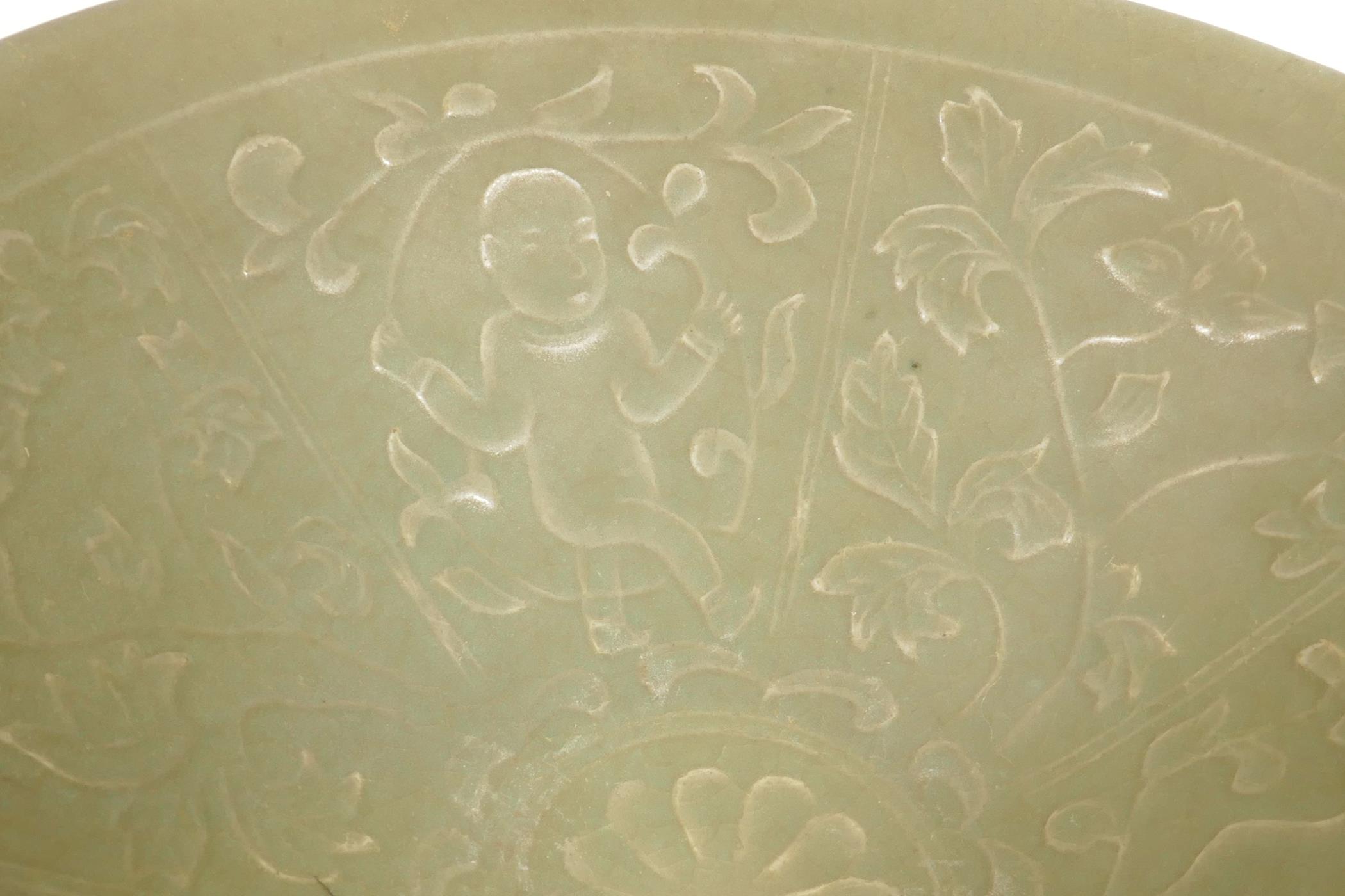 A Chinese celadon porcelain bowl, the interior embossed with figures, 7¼" diameter - Image 2 of 4