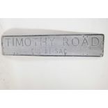 An aluminium street sign with raised enamelled letters, 44" x 9"