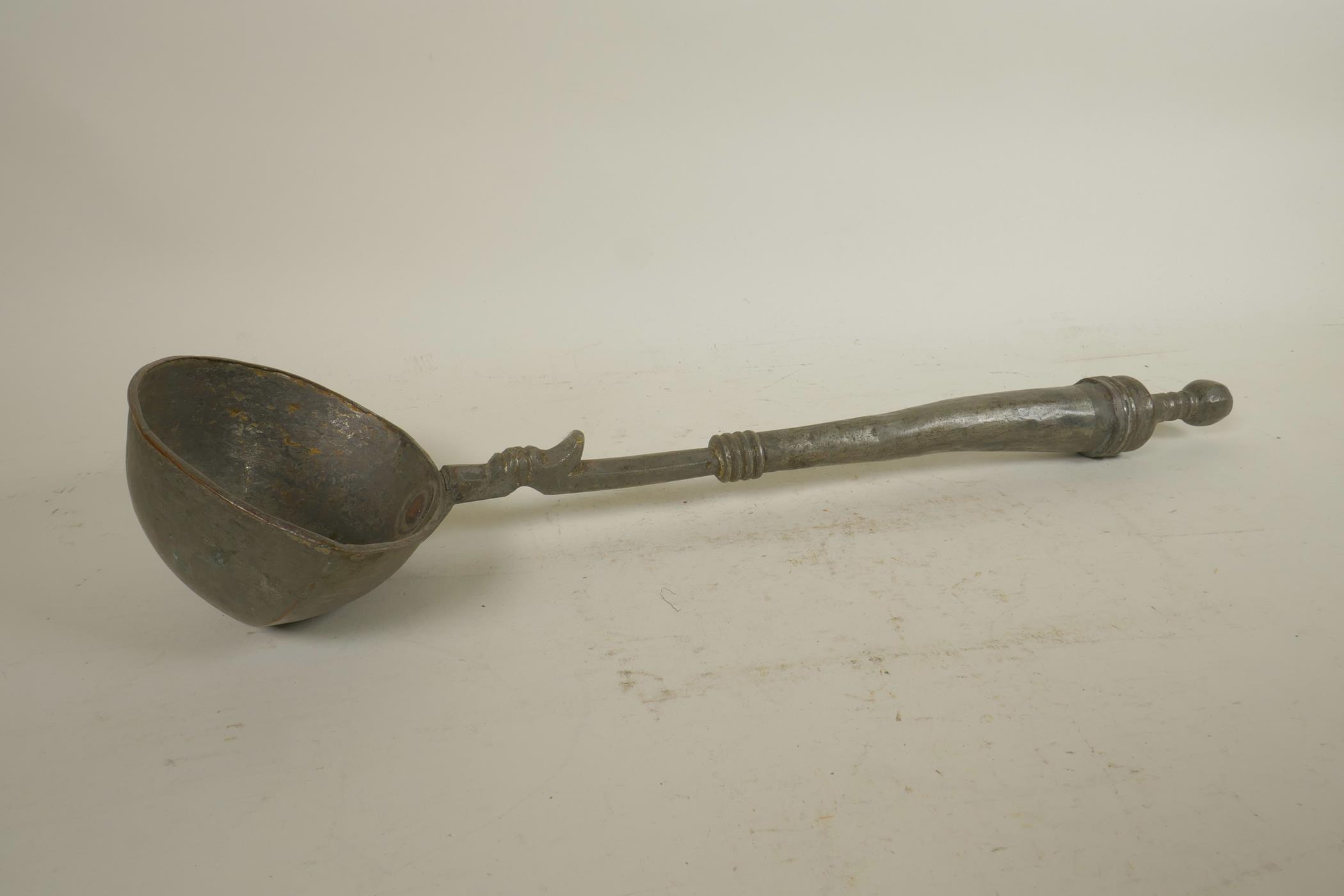 An antique Indian iron betel nut cutter, together with a metal oil ladle, 16" longest - Image 2 of 4