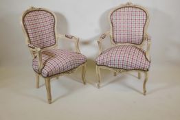 A pair of Louis style open arm chairs